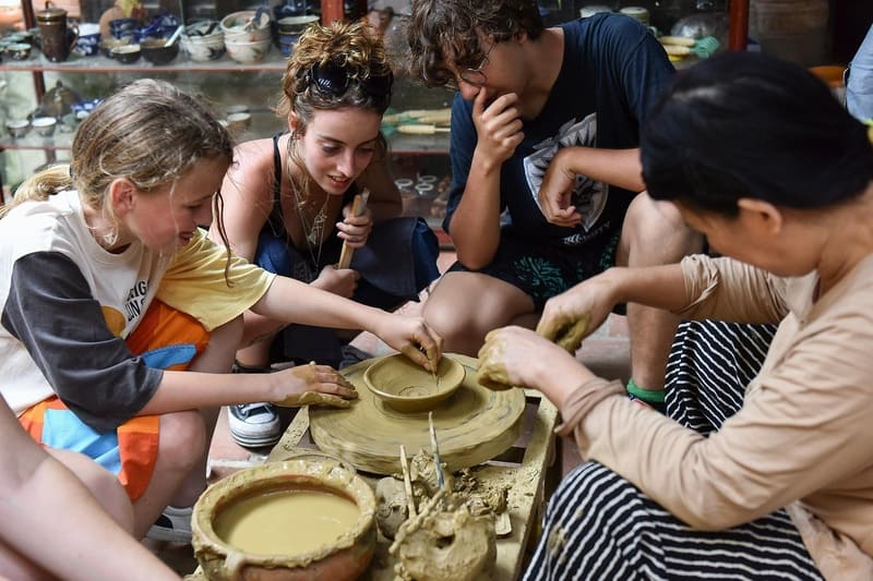 Trying pottery with local artisans