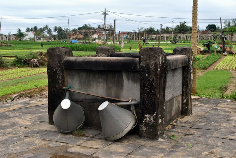 An old stone well in Tra Que Vegetable Village